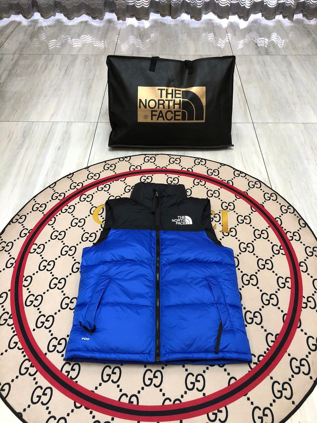 The North Face Puffer Vest in Royal Blue and Black with Stand Collar