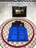 The North Face Puffer Vest in Royal Blue and Black with Stand Collar